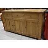 A modern solid oak sideboard by Willis and Gambier outlook measuring approx 160cm long 49cm wide and