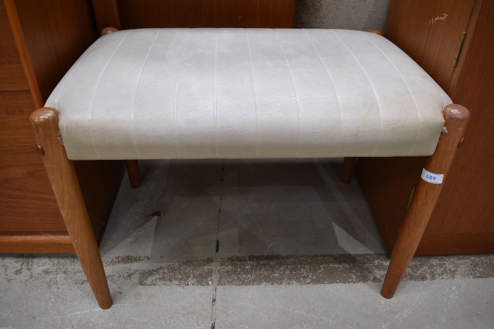 A vintage PVC dressing table stool having teak legs