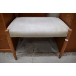 A vintage PVC dressing table stool having teak legs