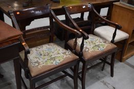 A pair of 19th Century carver style chairs having scrolled arms tree of life styled upholstery on