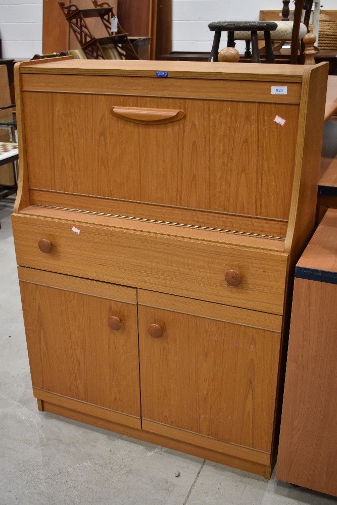 A vintage laminate teak effect bureau, width approx. 79cm