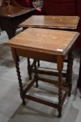 An early 20th Century oak side table having twisted legs on traditional frame work and a similar