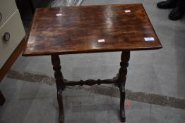 A Victorian style stained frame occasional table on turned frame