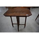 A Victorian mahogany folding table in the campaign style having turned frame, canted top, approx. 60