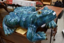 A large heavy cast ceramic tree frog figure in a teal blue and green glaze approx 65cm long