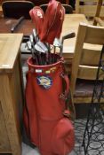 A vintage Dunlop golf bag with a set of Slazenger golf clubs
