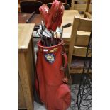 A vintage Dunlop golf bag with a set of Slazenger golf clubs