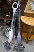 Two modern steam floor cleaners by Shark including a Lift Away also bag of accessories