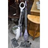 Two modern steam floor cleaners by Shark including a Lift Away also bag of accessories