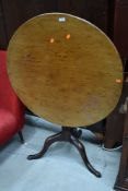 A 19th Century mahogany fold over table on triple splay legs, diameter approx. 80cm