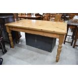 A traditional pine kitchen table, approx. 153 x 92cm