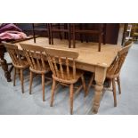 A traditional pine kitchen table and four similar solid seat chairs, table dimensions approx. 183