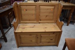 A modern natural pine box settle of small proportions, width approx. 91cm