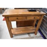 A modern hardwood side table having two frieze drawers, width approx. 91cm