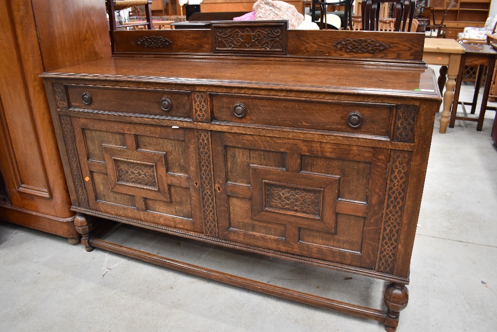 An early 20th Century oak sideboard, width approx. 153cm