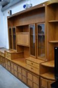 A retro styled Nathan wall unit having dresser side board and corner unit all in very good