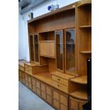 A retro styled Nathan wall unit having dresser side board and corner unit all in very good