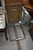 A modernist styled chrome framed and glass side table