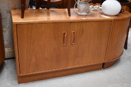 A teak effect low cupboard and corner unit by G Plan