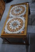 A vintage 1970's tile topped coffee table with hard wood body approx 95 long 47cm wide