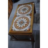 A vintage 1970's tile topped coffee table with hard wood body approx 95 long 47cm wide