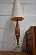 A vintage turned wood table lamp