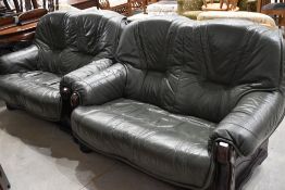 A pair of modern green leather settees, in wooden frames, the seats are removable from the frames
