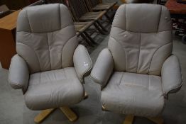 A pair of leather recliner armchairs, not Stressless, seats a bit perished
