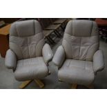 A pair of leather recliner armchairs, not Stressless, seats a bit perished