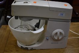 A Kenwood kitchen aid or chef with plastic bowl and accessories