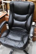 A modern black leatherette office chair