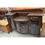 A early 20th Century stained frame break bow front chiffonier base, width approx. 135cm