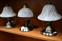 Two smoked glass bell shade table lights and similar desk top version