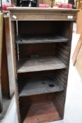 A vintage music cabinet in need of restoration