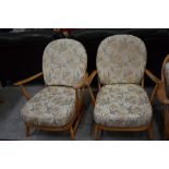 A pair of light Ercol cottage style armchairs