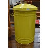 A lime green rubbish bin or trash can