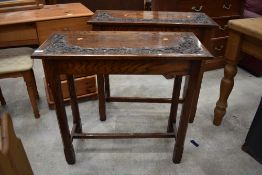 A pair of 19th Century oak side tables having carved vine decoration to top, each approx. 78cm wide,