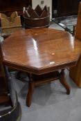 A late Victorian light mahogany or satinwood hexagonal table with under shelf in good condition