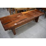 A rustic yew wood form, approx. 133 x 38cm, would work equally well as a coffee table