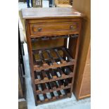 A modern hardwood wine rack (16 bottles) with frieze drawer