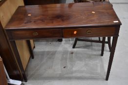 An early 20th Century reproduction Regency style mahogany side or hall way table with frieze drawers