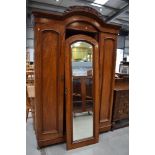 A Victorian mahogany wardrobe having central mirror door, width approx 143cm