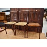 Three matching Edwardian mahogany and inlaid bedroom chairs, probably Maple & Co, with a variety