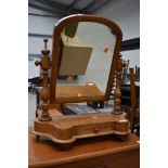 A Victorian toilet mirror on drawer base, light stain, some historical worm been treated