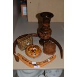A selection of treen including boxes, vase and articulated snake.