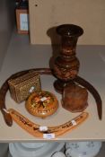 A selection of treen including boxes, vase and articulated snake.