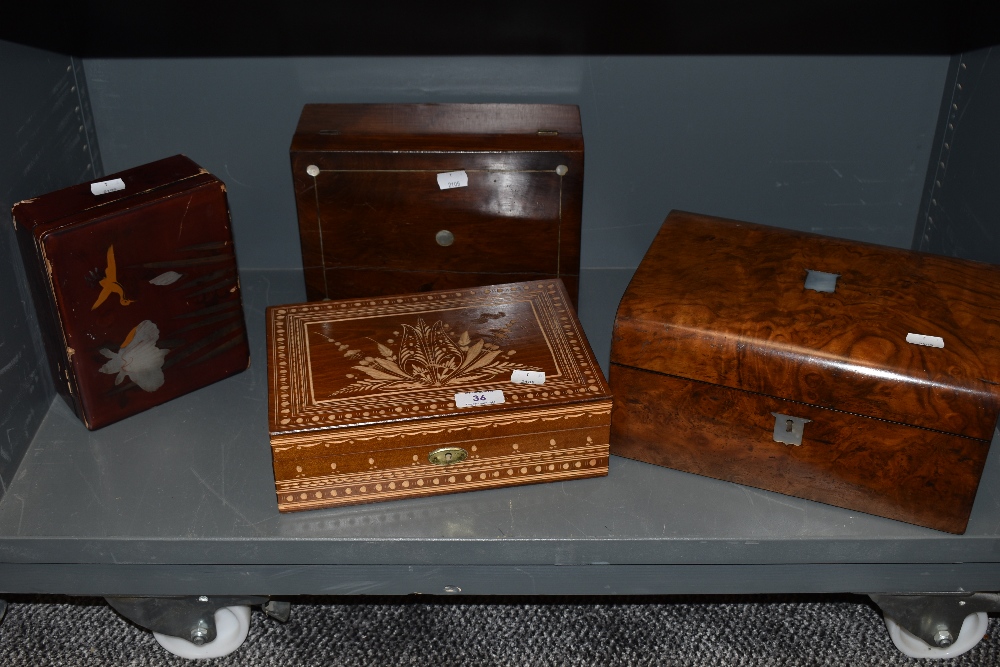An assortment of boxes including walnut veneered with mother of pearl inlay, etched examples and