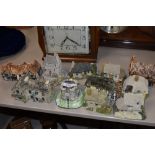 A collection of Lilliput lane style cottages and similar ceramic ones.