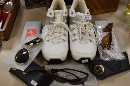 A pair of size 10.5 Timberland trainers, three pairs of sunglasses,two bearing ray band logo with