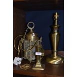 A mixed lot of brass including table lamp, isle of man horse brass,candle stick and ceiling light.